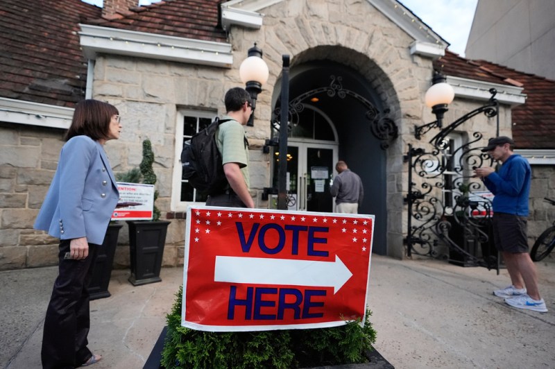 People wait in a line at a precinct before voting during a Georgia primary on Tuesday, May 19, 2026, in Atlanta.